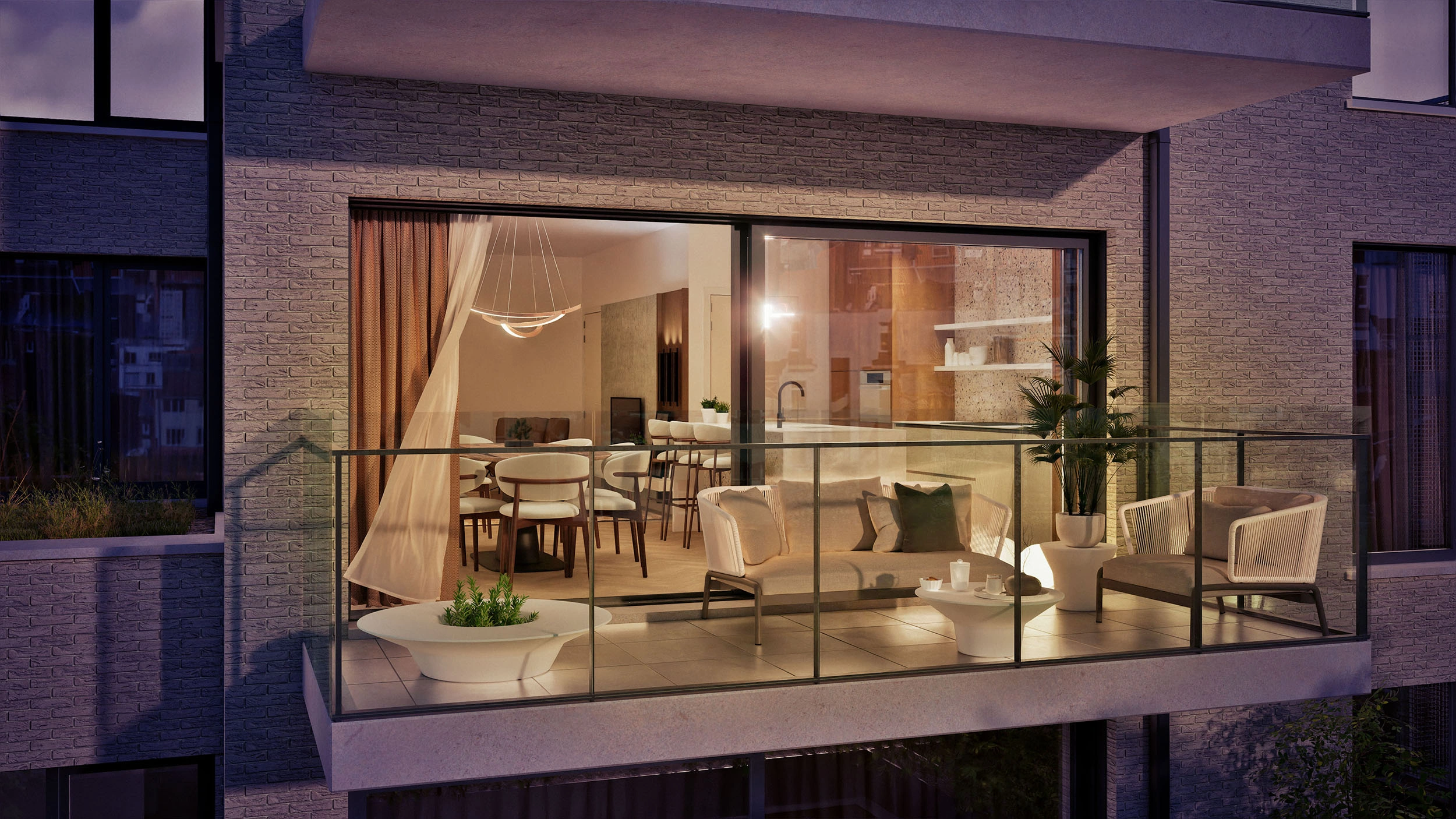 Balcon contemporain avec salon d’extérieur offrant une vue sur un espace de vie ouvert, comprenant le séjour, la salle à manger et la cuisine, chaleureusement éclairés en soirée.